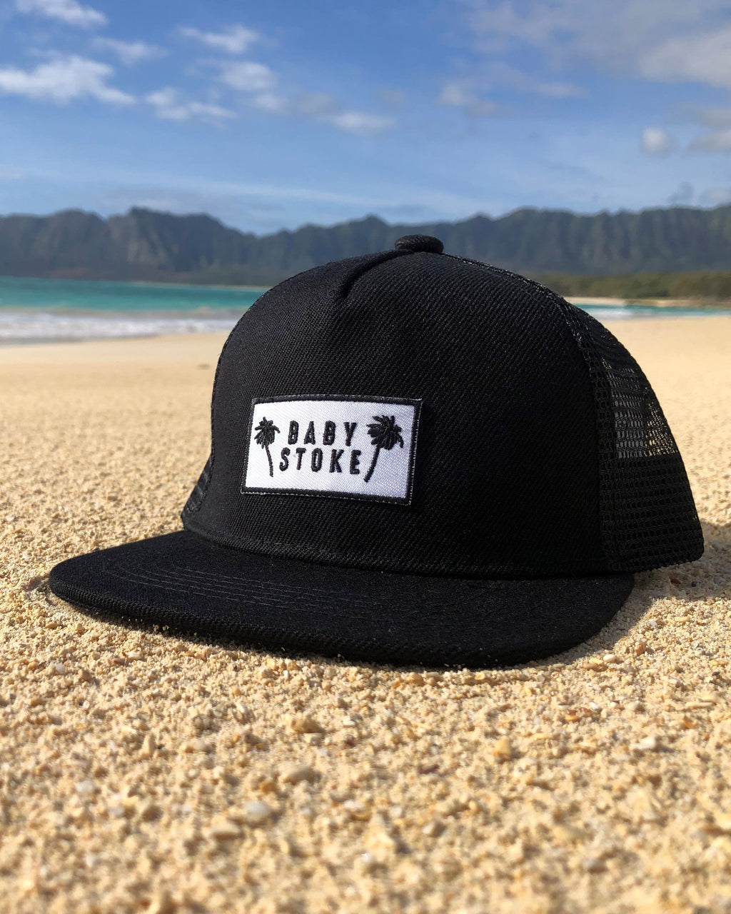 Black Palm tree trucker hat for toddlers on the beach in the sand in hawaii on an adventure provides protection from the sun copy