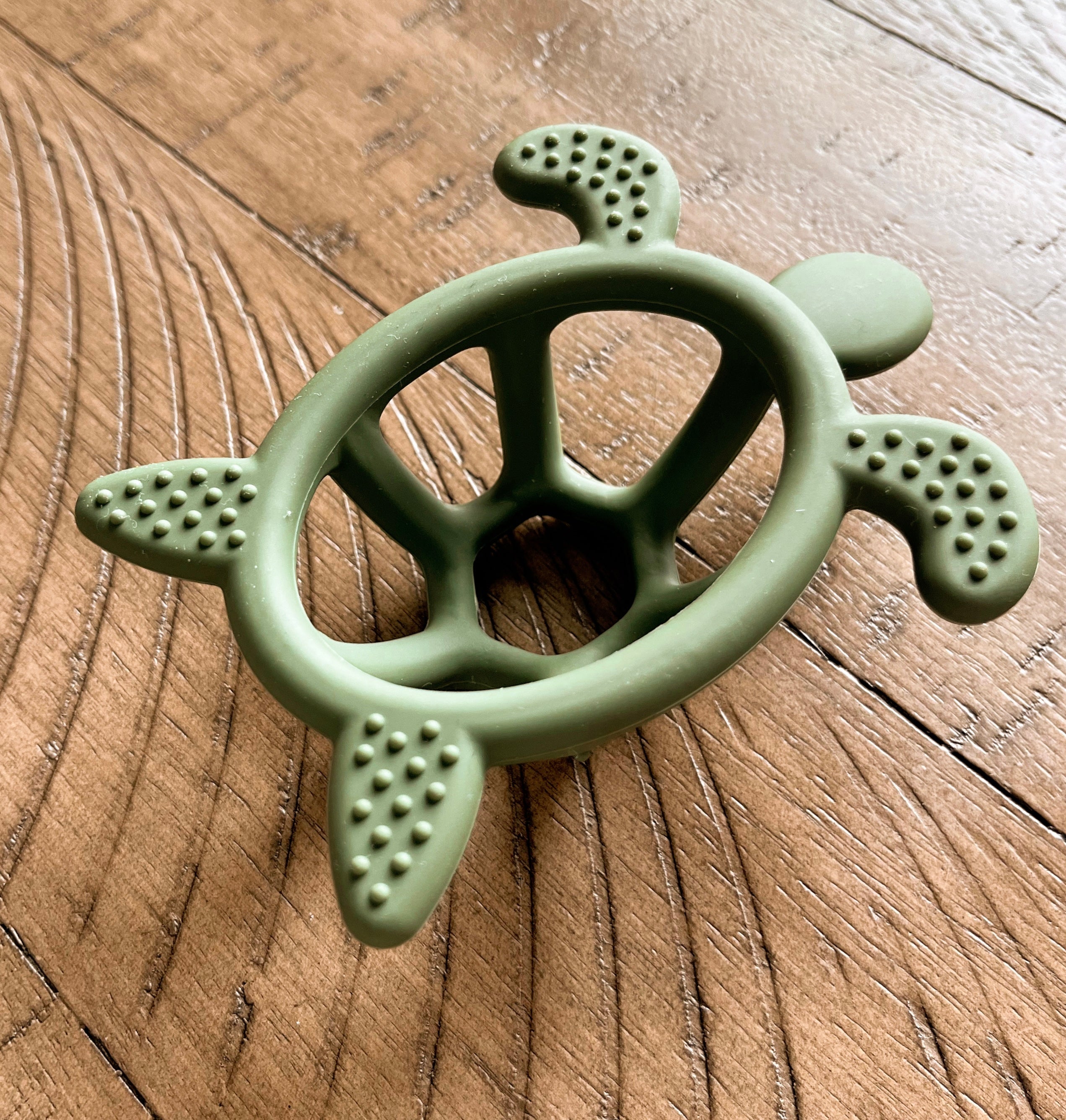 Tropical teething turtle toy with textures to help your baby with teething, green fun toy, underside