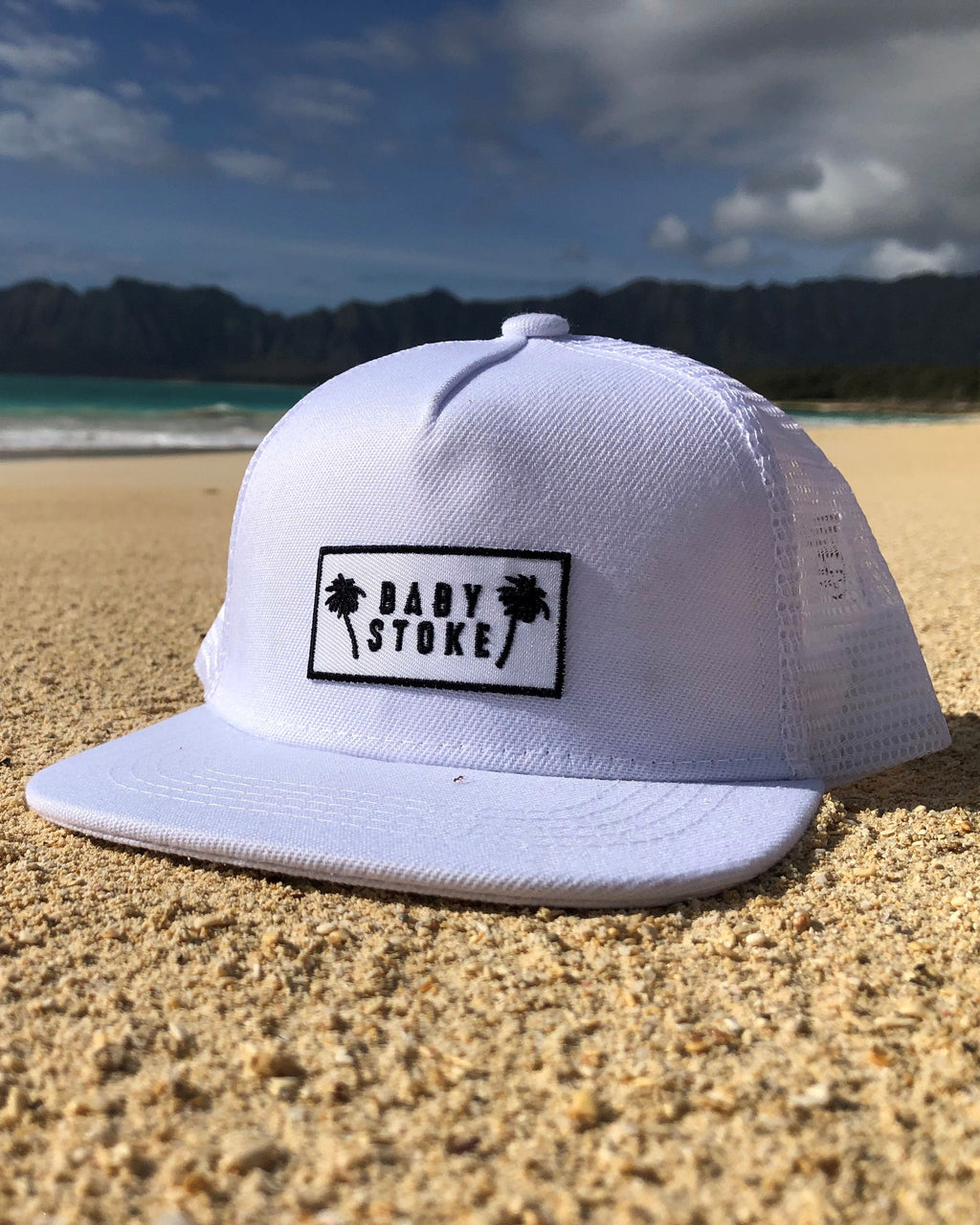 White Palm tree trucker hat for toddlers on the beach in the sand in hawaii on an adventure provides protection from the sun copy