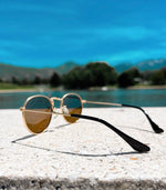 Load image into Gallery viewer, baby and toddler sunglasses with gold rims and black lenses perfect for sunny days
